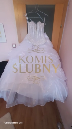 Sprzedam suknię ślubną - rozmiar -xs/s, piękna , jak nowa, gorset z glębokim dekoltem + dól spodnica /księżniczkowa na kole, plus nażutka .
